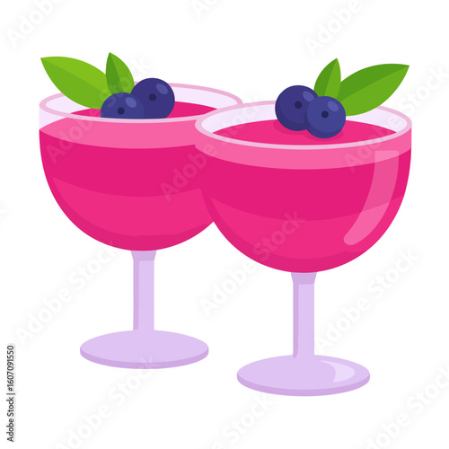 Two elegant coupe glasses filled with pink berry mousse, garnished with fresh blueberries and mint leaves.