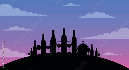 Silhouette of wine bottles and glasses on a hill at sunset with cloudy sky