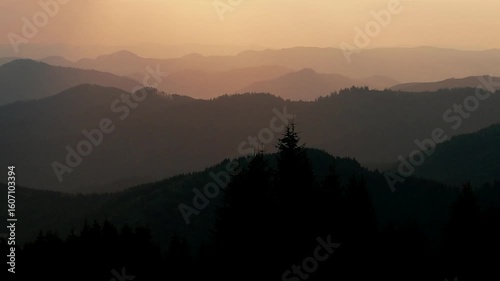 Panorama of mountain silhouettes at sunrise