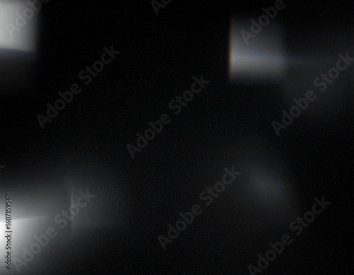 Black, blurred background with spots of light.