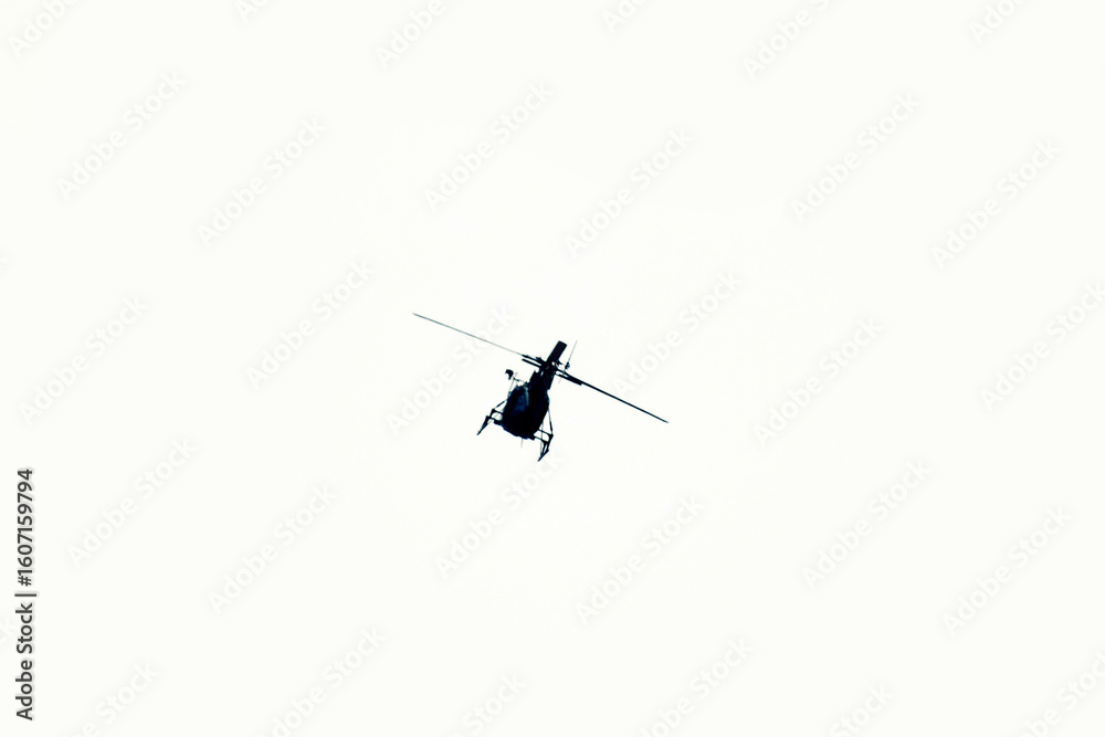 Fototapeta premium helicopter is flying on isolated white background