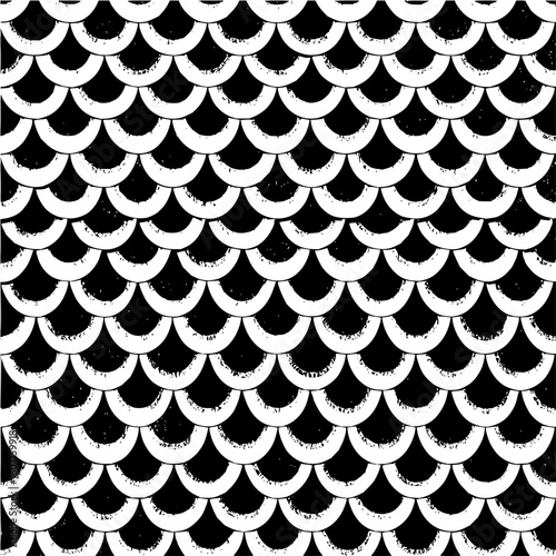 Black and white seamless pattern of overlapping semicircles creating a textured scale like design