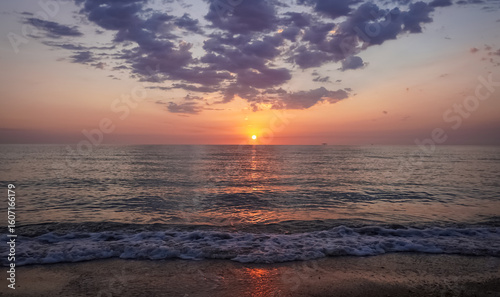 Orange sunrise over the sea. Morning serenity