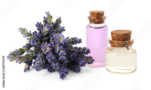 Natural essential oil and lavender flowers isolated on white