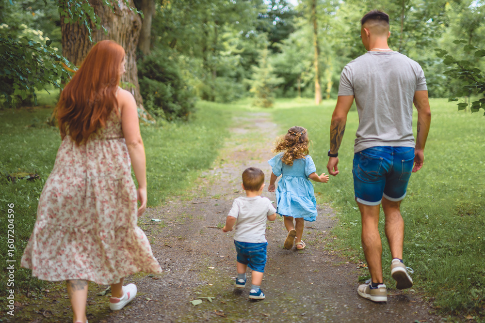 Obraz premium Beautiful happy family enjoying in the park