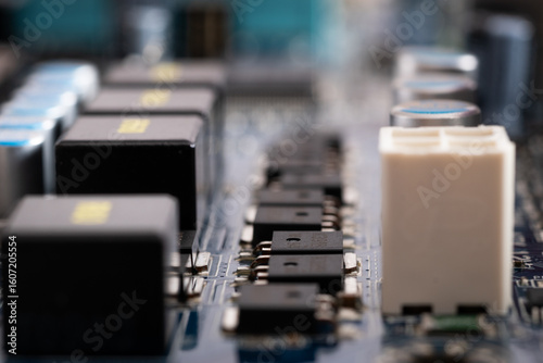 Close up of microchips in row on motherboard, electronic components
