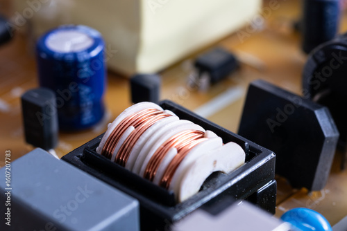 Close up of electronic components in television, electromagnetic interference filter with plastic core