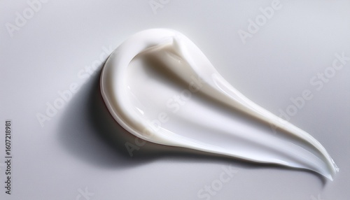close up smooth white cream or lotion swatch on a minimal white background creamy texture skincare beauty product facial moisturizer