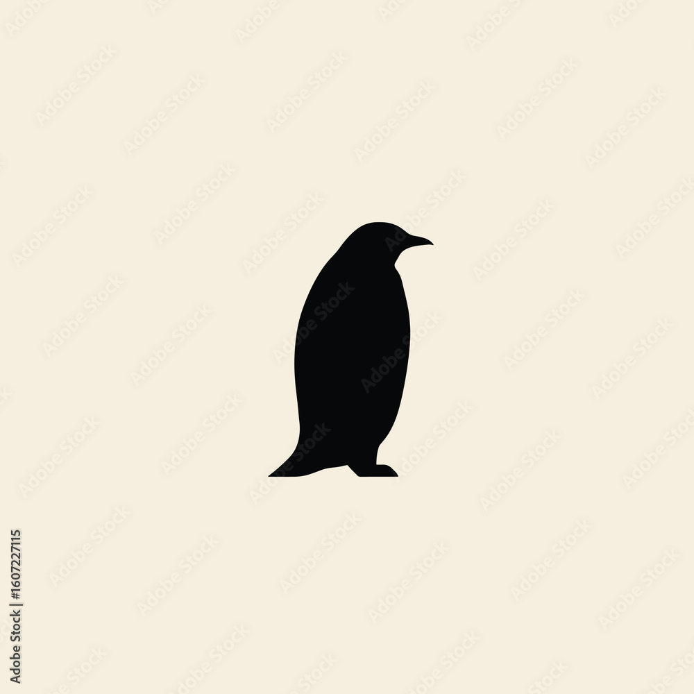 Obraz premium A simple black silhouette of a penguin standing against a light cream-colored background.