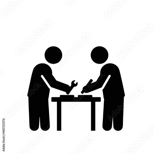 Two men collaborating on woodworking project at workshop table  