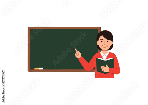 	Female teacher pointing at a green blackboard while teaching.