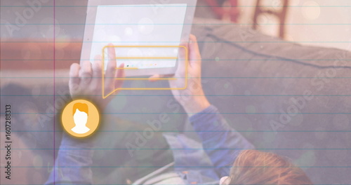Reclining man tapping white tablet in home living room, with chat bubble and avatar icon graphic