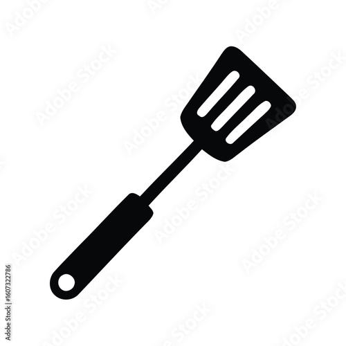Black silhouette of a slotted spatula kitchen utensil