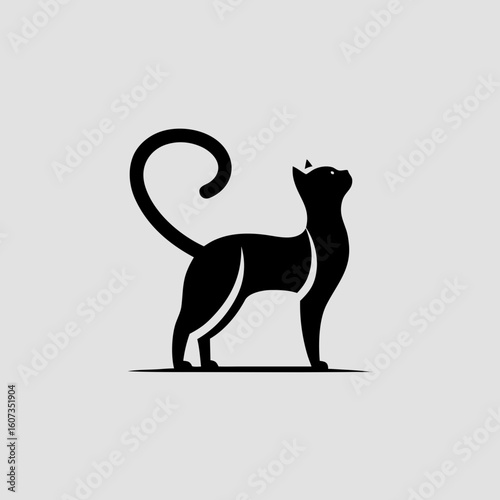 Black cat silhouette looking up on a light gray background animal