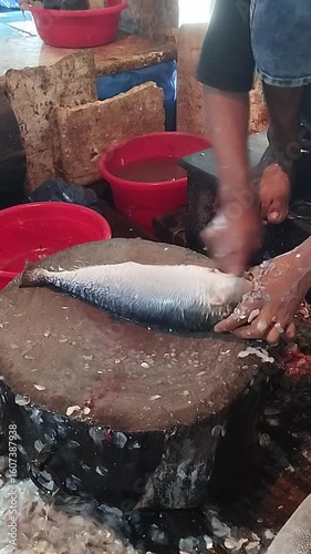 Cleaning and Preparing Fresh Catch of Fish at a Local Market A Glimpse into Traditional Seafood Preparation 4K Realistic Image