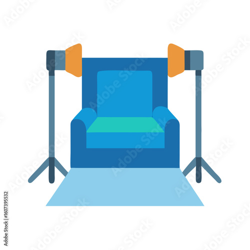 Studio setup with blue chair and lighting equipment