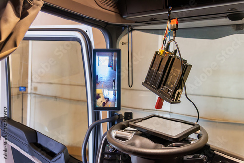 Tachograph software update on a truck at a certified specialist workshop, mandatory for newly installed next-generation tachographs.