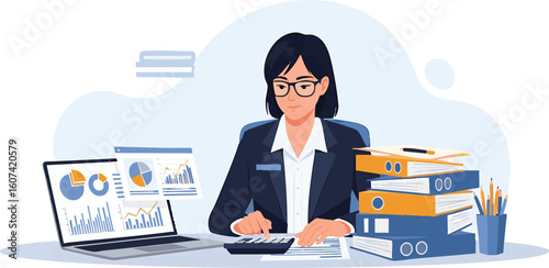 A woman in a suit works at a desk with a laptop displaying charts and graphs, using a calculator.