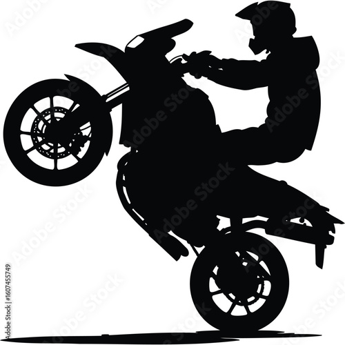Silhouette of Motocross Rider Performing Wheelie