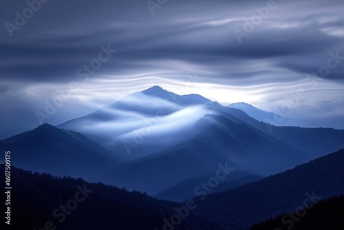 A tranquil mountain range veiled in soft ethereal mist