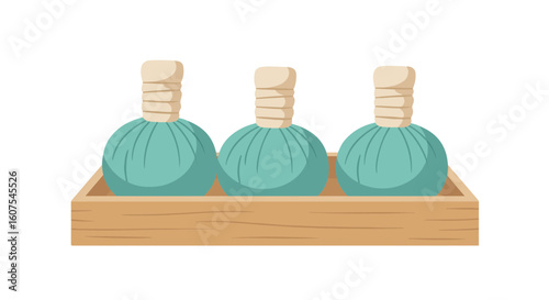 Three herbal compress balls arranged in a wooden tray, essential for spa therapies and relaxation.