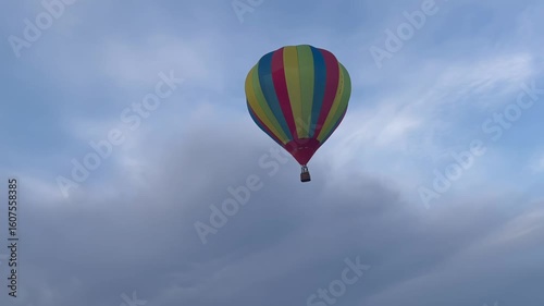 Colorful hot air balloon flying in blue sky


