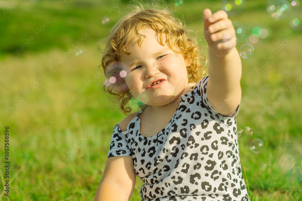 Child Plays With Bubbles in a Sunlit Field While Enjoying a Joyful Afternoon Outdoors Child Plays With Bubbles in a Sunlit Field While Enjoying a Joyful Afternoon Outdoors