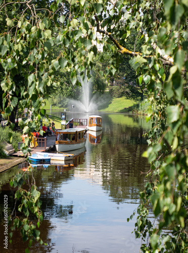 Fototapeta Naklejka Na Ścianę i Meble -  Traditional wooden boat on canal in Riga