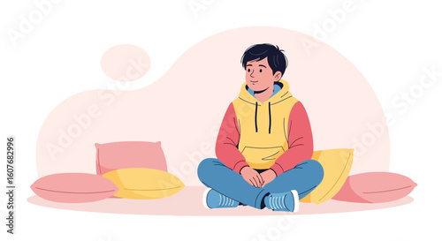 Boy Sitting In A Cross Legged Position Relaxing With Pillows Around Him