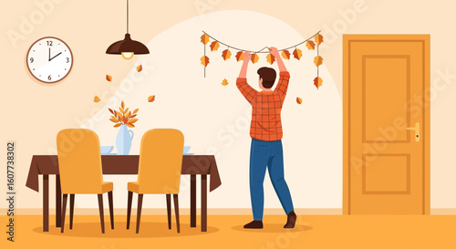 Decorating For Autumn A Man Hanging Fall Decorations In His Dining Room