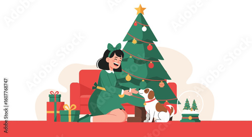 Happy Girl Playing With Her Dog Near Christmas Tree At Home