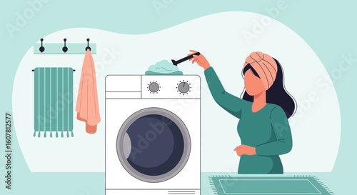 Woman Doing Laundry Adding Soap Powder To Washing Machine At Home