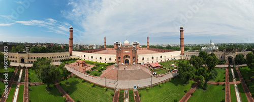 Magnificent 4K drone photo of the Badshahi Mosque in Lahore, Punjab, Pakistan. Showcasing the grandeur of Mughal architecture with its red sandstone walls, domes, and minarets. An aerial capture.