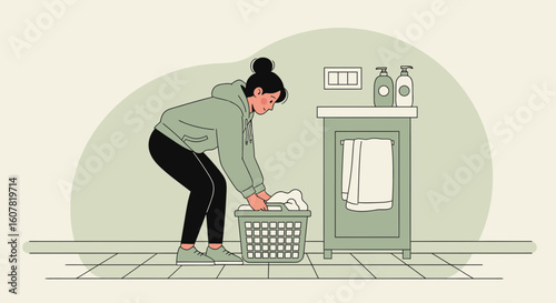 Woman Sorts Laundry In Bathroom In A House Or Apartment Interior