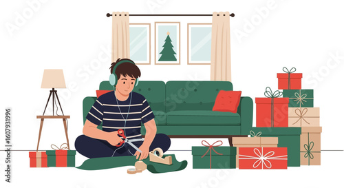 Young Man Wrapping Presents for Christmas with Headphones On at Home