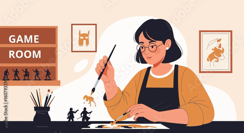 Young Woman Creatively Painting Miniature Figures In The Gameroom At Her Home