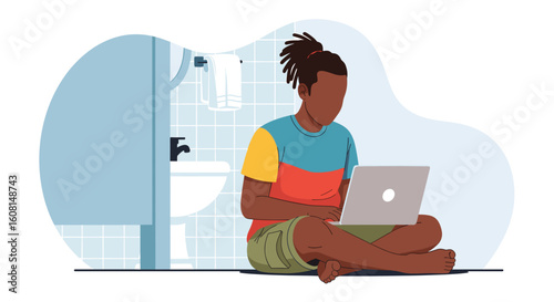 Young man working on laptop in a bathroom, perfect for articles about remote work, modern lifestyle or flexible work.