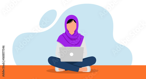 Muslim woman working on laptop, perfect for websites and brochures promoting diversity and inclusion.