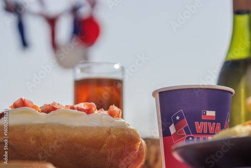 Chilean Independence Day: Chilean completo hot dog with tomato and mayonnaise in patriotic celebration