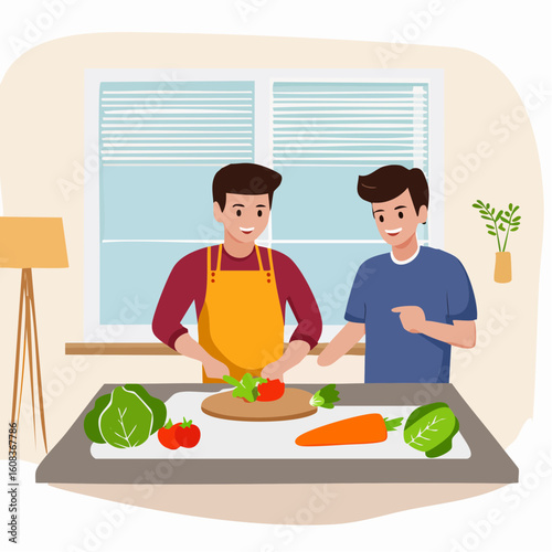 A smiling man in an apron chops a tomato on a cutting board while his friend happily watches and points.