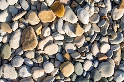 Fototapeta Naklejka Na Ścianę i Meble -  Immerse yourself in tranquility with this high-resolution image of smooth beach stones. Ideal for backgrounds and design elements, it adds a calming, natural aesthetic to any project.