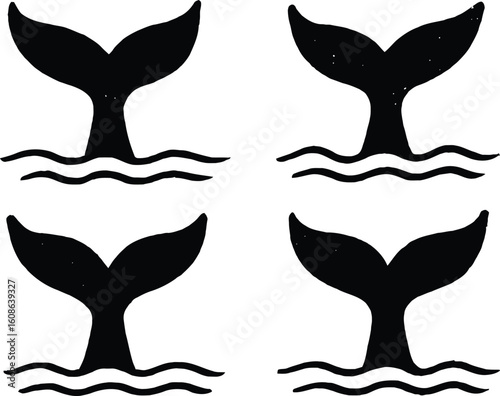 Four black whale tails emerging from wavy water fluke ocean