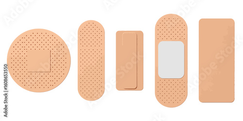First Aid Essential Bandages: A close-up shot of various adhesive bandages, showcasing their different shapes and sizes, ideal for illustrating healthcare and wound care concepts. 