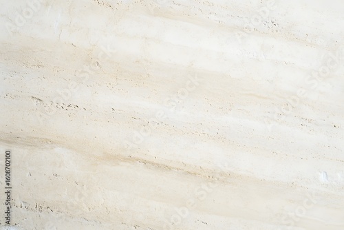 Textured travertine surface with horizontal grain lines, creamy tones, polished highlights create elegant architectural background.