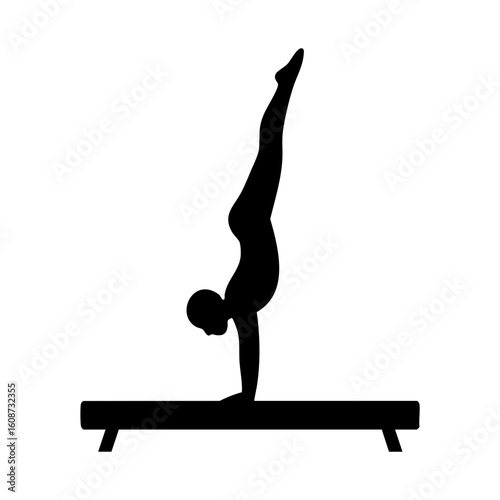Silhouette of female gymnast handstanding on balance beam