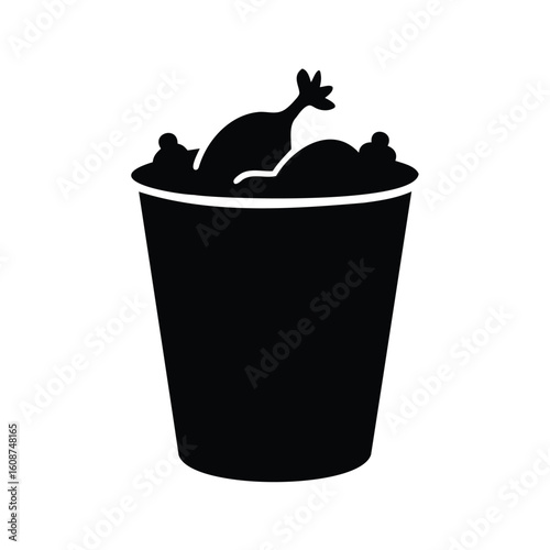 Silhouette of bucket full of fried chicken pieces, ready to serve