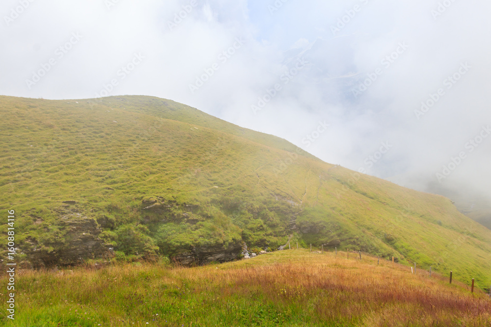Fototapeta premium Swiss Alps covered with fog. Travel in Switzerland