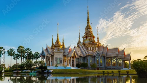 Timelapse of Wat Non Kum or Wat Luang Pho To in Sikhio District, Nakhon Ratchasima, Korat, Thailand is a symbolic place of temples in Thailand. At sunset, there is a reflection in the water.