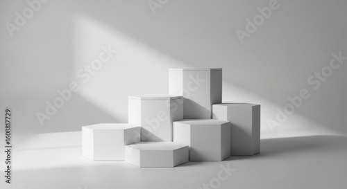 Minimalist hexagonal pedestal stage with soft light and shadows