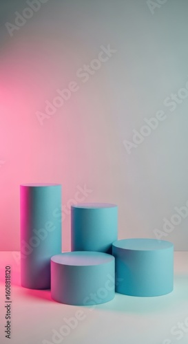 Minimalist cylindrical pedestals with pink and teal lighting